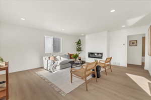 Living room with light wood-type flooring