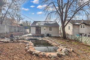 Rear view of property featuring french doors, a patio, and central air condition unit