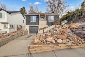 View of front facade featuring a garage