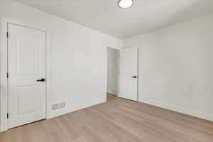 Spare room with light hardwood / wood-style flooring