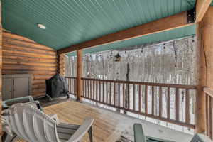 Snow covered deck with area for grilling