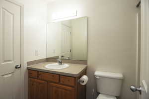 Bathroom with vanity and toilet