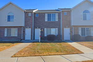 View of front of property with a front yard