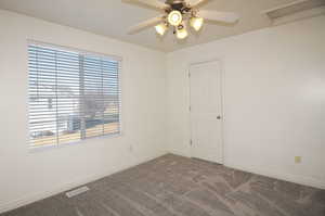 Unfurnished room with carpet floors and ceiling fan