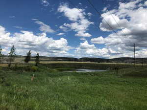 View of yard with a rural view