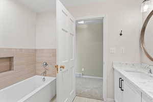 Bathroom with a bath and vanity