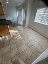 Unfurnished living room with light tile patterned floors