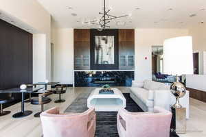 Interior space featuring a notable chandelier and recessed lighting