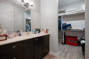 Bathroom featuring vanity and hardwood / wood-style flooring