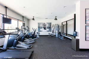 Gym featuring recessed lighting, baseboards, and a textured ceiling