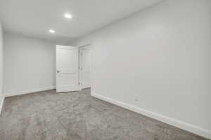 Unfurnished room featuring recessed lighting, carpet flooring, and baseboards