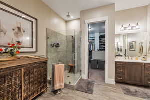 Bathroom with vanity and an enclosed shower