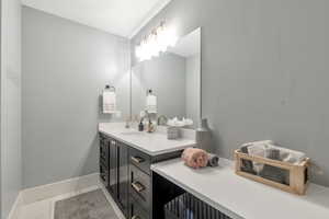 Bathroom featuring vanity and tile patterned floors