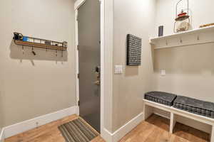 Mudroom with light wood-type flooring