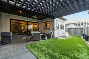 Exterior space featuring an outdoor living space, a yard, and a patio