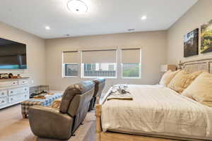 Bedroom with light colored carpet