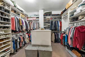 Walk in closet featuring carpet