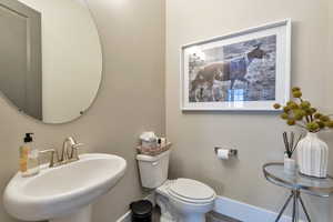 Bathroom featuring sink and toilet