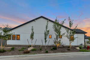 View of property exterior at dusk