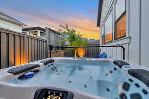 Exterior space with a hot tub