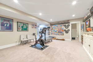 Workout area featuring light carpet