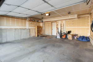 Garage featuring a garage door opener