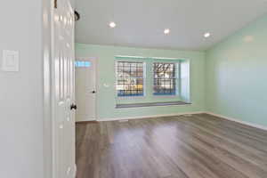 Spare room featuring wood-type flooring