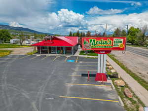 View of parking / parking lot featuring a mountain view