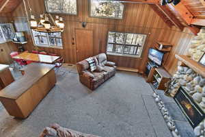 Living room featuring light carpet and wooden ceiling