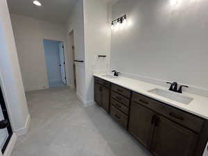 Bathroom featuring vanity and tile patterned floors