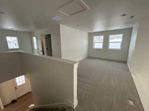 Unfurnished room with light colored carpet