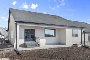 Back of house with a patio area, central AC unit, and a mountain view