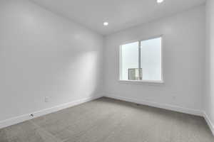 Unfurnished room with carpet flooring