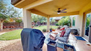 View of patio / terrace with ceiling fan and area for grilling