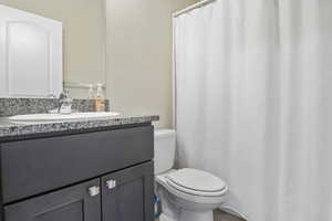 Bathroom with vanity and toilet