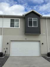 Exterior space featuring central AC and a garage