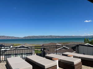 Wooden terrace with a water and mountain view