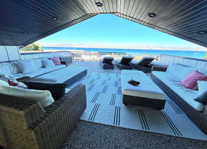 View of patio / terrace featuring a water view and an outdoor hangout area