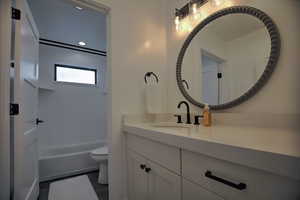 Bathroom featuring vanity and toilet