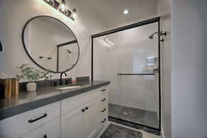 Bathroom featuring vanity and walk in shower