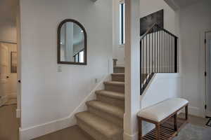 Stairs with hardwood / wood-style flooring