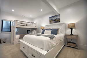 Carpeted bedroom with beamed ceiling