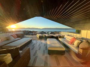 Exterior space featuring an outdoor living space and a water and mountain view