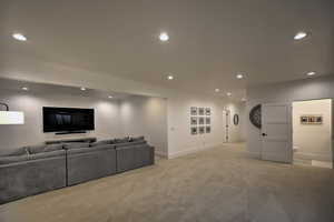 Living room featuring light colored carpet