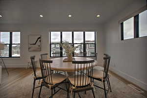 Dining room with hardwood / wood-style floors