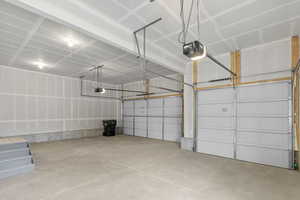 Garage featuring a garage door opener