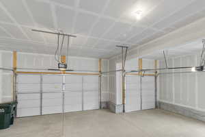 Garage featuring a garage door opener