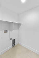 Washroom with washer hookup and electric dryer hookup