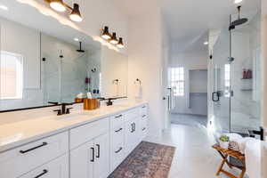 Bathroom featuring vanity and walk in shower