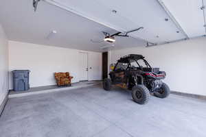 Garage featuring a garage door opener